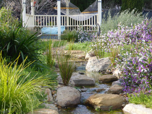 Lysterfield garden - stream leading up to a gazebo