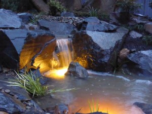 Camberwell - sheet waterfall lit up at night.